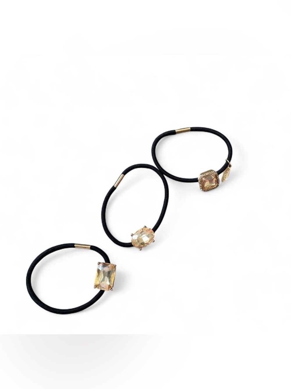 black hair ties with gold accents